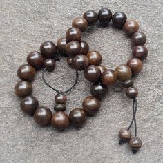 Description :  Size : 16 MM average Contain : 14 beads per strand Weight : about 30 grams Origin : Java - Indonesia These beads are handmade from genuine Indonesia Rosewood (Dalbergia Latifolia). Generally known as Sonokeling Wood in Indonesia. It has a charming dark brown color and comes with a crown on each bracelet. Some beads maybe not perfectly round and a little different size So beautiful and makes a Great gift! You will receive similiar item as shown in the picture  (Due to the difference settings between monitor and the lighting, the pictures may not reflect the exact color of the item). So please read the items description carefully before place a bid. Brown Rosary Bracelet For Meditation, Brown Rosary Bracelet With 8mm Beads For Meditation, Spiritual Brown Rosary Bracelet With Wooden Beads, Wooden Beads Rosary Bracelet For Meditation, Hand-strung Brown Beaded Bracelets For Meditation, Brown Hand-strung Beaded Bracelets For Meditation, Spiritual Brown Wooden Beaded Bracelets, Meditation Rosary Bracelet With Wooden Beads, Spiritual Brown Beaded Bracelets With Wooden Beads