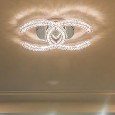 a chandelier hanging from the ceiling in a room