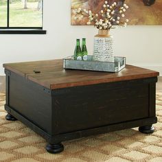 a coffee table with two beer bottles on it