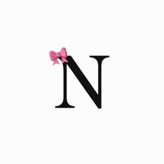 the letter n has a pink bow on it