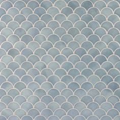 a blue and white fish scale tile pattern