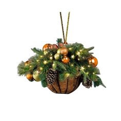 a basket filled with christmas ornaments and lights