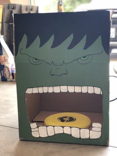 a cardboard box with an image of a monster's mouth