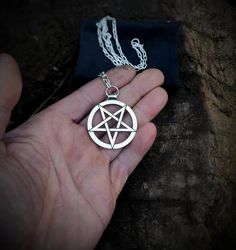 A magnificent mirror finish silver inverted pentagram necklace, the most recognizable symbol of rebelion and boldnes. Manifest your inner strength with this sacred symbol and bring fire and brimstone to your enemies. Get this necklace for your occult loved ones or your goth girlfriend, it is also a great gift for anyone who is into witchery and black metal. The whole necklace is made out of sterling silver, pendant, bail, chain and hook. The pendant is cast as a single piece of metal, no welding Goth Girlfriend, Inverted Pentagram, Jewelry Goth, Black Metal Art, Pentagram Necklace, Pendant Bail, Gothic Pendant, Goth Accessories, Witch Jewelry