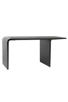 a black table sitting on top of a white wall