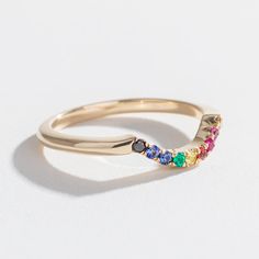 The Angela Monaco Jewelry Full Rainbow Contour Band is our second take on the AMJ Rainbow Sapphire Contour Band. For this beauty, we've added two diamonds to the original 14k yellow gold design to resemble The People of Color inclusive Pride flag which originated here in Philadelphia in 2017. 15% of all proceeds from the Full Rainbow Contour Band are donated to the Marsha P. Johnson Institute as part of our ongoing With Love and Pride campaign. Details Handmade in Philadelphia in 14K yellow gold Yellow Gold Multi-stone Jewelry For Anniversary, Anniversary Multi-stone Yellow Gold Jewelry, Gold Jewelry With Multi-stone Round Band, Multicolor 14k Gold Jewelry For Wedding, 14k Gold Rainbow Multi-stone Jewelry, 14k Gold Multi-stone Rainbow Jewelry, Rainbow Multi-stone 14k Gold Jewelry, Rainbow 14k Gold Stackable Jewelry, Rainbow Multi-stone Wedding Jewelry