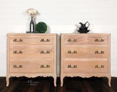 two wooden dressers sitting side by side on top of a hard wood floor next to a white wall