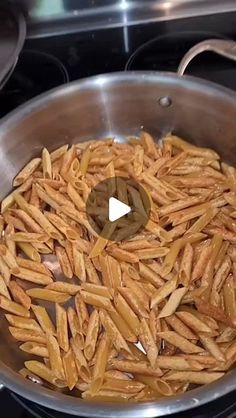 french fries are being cooked in a pan on the stove with a video playing below