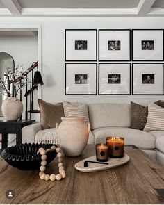 a living room filled with lots of furniture and pictures on the wall above it's coffee table