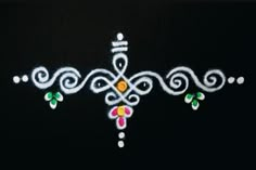 a black background with white, yellow and pink designs painted on it's side