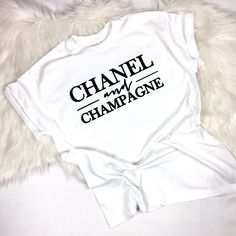 Black Or White T Shirt With White Lettering, Relaxed Fit. Sleeves Are Standard And Can Be Rolled Up, Cute For Layering And Leggings Classy Graphic Tee Outfit, Champagne Graphic, Chanel Pin, Chanel T Shirt, Classy Lifestyle, Designer Tees, Marathon Shirts, American Eagle T Shirts, Designer Sportswear