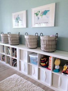 some baskets are sitting on top of the shelves