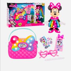 the minnie mouse toy is in its box and has accessories like a purse, headbands, bow tie, and sunglasses