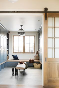 an open door leading to a living room filled with furniture