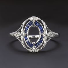 a white gold ring with blue sapphires and diamonds