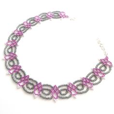 An Intricate Choker Handmade With Glass Seed Beads. A Dark Metallic Gray Is Accented With Orchid Purple/Pink And Pearlescent White. Secured With A Hook Clasp. Adjustable From 13.5 To 15 Inches. Not Intended For Children Under 12. Choker Handmade, Beading Netting, Orchid Purple, Beaded Jewelry Patterns, Hook Clasp, Glass Seed Beads, Bead Patterns, Beaded Jewelry Diy, Beaded Choker