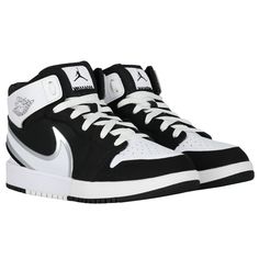 Black and white Jordan 1 Mid Easyon trainers for boys and girls by Nike. Made from soft premium leather and canvas, they have a wide, flexible collar easily bends over the heel, allowing to slip into these trainers without adjusting the laces. They feature the iconic Air Jordan "Wings" logo on the side and the Jumpman logo graces the tongue.#jordan1mid #nikekids #airjordantrainers #sneakerheads White Jordan 1, Black And White Jordans, Black White Jordans, Jordan Wings, White Jordans, Jumpman Logo, Wings Logo