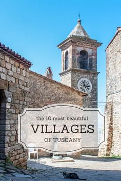 an old stone building with a clock tower in the background that reads village of tuscany