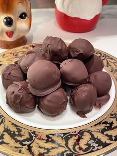 a plate full of chocolate truffles on a table