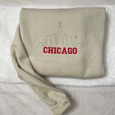 Chicago Embroidered Crewneck/Sweatshirt  Hello there! Please message me if you have any additional questions or want to change thread colors. We are a family-run Etsy page; my husband and I make all orders from home. You can also send us a message if you would like a custom sweatshirt/t-shirt with whatever words and images, and we will see if we can accommodate your order! HOW TO ORDER - Please Choose the SIZE and COLOR From Drop Down Menu. MATERIAL - We use JerZees as our blanks; I may sometime Casual Winter Sweatshirt With Machine Embroidery, Casual Sweatshirt With Machine Embroidery And Relaxed Fit, Casual Relaxed Fit Sweatshirt With Machine Embroidery, Winter Hoodie With Crew Neck And Machine Embroidery, Winter Streetwear Top With Machine Embroidery, Cotton Crew Sweatshirt With Machine Embroidery, Casual Streetwear Tops With Machine Embroidery, Casual Long Sleeve Sweatshirt With Machine Embroidery, Cotton Sweatshirt With Machine Embroidery For Winter