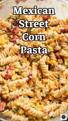 mexican street corn pasta in a glass bowl with the words, mexican street corn pasta