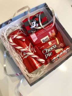 a box filled with assorted chocolates on top of a table