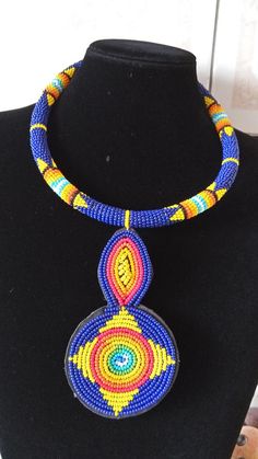 African Beaded Pendant Necklace,  Zulu Necklace, African Jewelry, Women Jewelry, Gift for her, Tribal necklace, Moms GiftThis pendant  necklace is superbly crafted.Main Color - Dark blue.Different colors can be available.Feel free to send me a convo or e-mail for any clarification or more information.Thank you for visiting and happy shopping! Traditional Blue Choker With Colorful Beads, Traditional Blue Beaded Choker, Traditional Blue Beaded Choker Necklace, Traditional Blue Beaded Necklace, Traditional Blue Beaded Necklace For Gift, Traditional Blue Beaded Jewelry, Traditional Blue Round Beads Necklace, Traditional Blue Round Beaded Necklaces, Unique Blue Beaded Necklaces