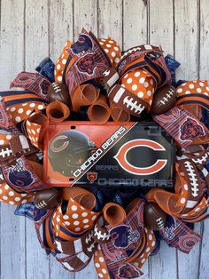 the chicago bears football deco mesh wreath is hanging on a wooden door with polka dots