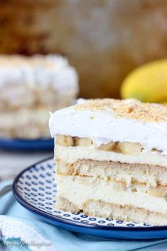 a close up of a piece of cake on a plate with bananas in the background