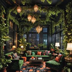 a living room filled with lots of green furniture and plants hanging from the ceiling above