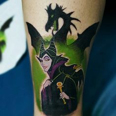 a male with a dragon tattoo on his leg