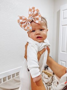 This Checkered Fancy Bullet Bow is the ultimate accessory for your little nestling. Crafted from durable bullet fabric, the Fancy bullet bow headwrap is designed to maintain its shape without sagging. Perfect for bringing home baby outfit, all the way to summer adventures! color: Peach Checkered fabric type: Bullet Our Fancy Bullet Bows come in the following options: **Headwrap (5inch bow) **Nylon (5inch bow) **Clip (5inch bow) **Piggies (two 3inch bows on clips) Headwrap Sizing: -Newborn Headwr Adjustable White Headband For Playtime, Cute White Headband With Bow Tie, Adjustable Playful Bow For Playtime, Cute White Cotton Hair Accessories, Adjustable White Hair Accessories For Playtime, White Headband With Bow Tie, Cute White Bow With Matching Headband, White Bow Tie Headband, Bringing Home Baby Outfit