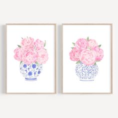 two pink flowers in blue and white vases