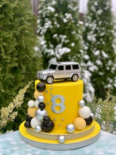 a birthday cake with a car on top