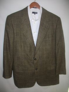 "This is a Vintage 70's Neiman Marcus Oxford Clothes Men's 100% Wool Windowpane Madman Sports Coat Sz 40. This handsome sport coat features a 2 button front and a center back vent. It has been gently worn and is in mint condition. Measurements Length 32\" Shoulders 20\" Measured seam to seam Sleeves 23\" Plus 2\" of extra material Chest 44\" Measured from armpit to armpit" Casual Brown Suit With Welt Pockets, Retro Spring Blazer, Mens Wool Coats, Seventies Fashion, Sports Coat, Wool Coats, Men Clothes, Prince Of Wales, Mad Men