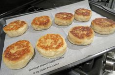 some biscuits are sitting on top of a baking sheet in the oven and ready to be baked