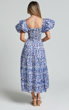 Nelrose Midi Dress - Short Puff Sleeve Front Cut Out Dress in Blue Print | Showpo USA Blue Floral Print Midi Dress With Puff Sleeves, Blue Floral Print Midi Length Puff Sleeve Dress, Blue Floral Print Puff Sleeve Midi Dress, Blue Puff Sleeve Dress For Summer, Blue Puff Sleeve Dress With Short Sleeves For Summer, Blue Puff Sleeve Dress With Smocked Back For Brunch, Ruched Puff Sleeve Short Dress For Vacation, Blue Puff Sleeve Dress For Garden Party, Ruched Puff Sleeve Dress For Vacation