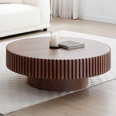 a coffee table with a cell phone on it