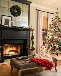 a living room with a fireplace and pictures on the wall, along with other decorations