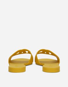 Rubber beach slides with DG logo: Yellow Rubber sole with embossed logo Made in Italy Designer Beach Slides With Branded Insole, Designer Slides With Branded Insole For Beach, Designer Flat Slides For Beach, Classic Flat Slides For Vacation, Classic Slides For Summer Vacation, Classic Summer Slides For Vacation, Classic Summer Vacation Slides, Designer Slides For Summer, Classic Slip-on Beach Slides