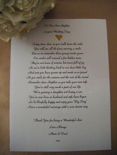 a piece of paper with a poem written on it next to a bouquet of flowers