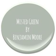 a white painted round with the words, misted green by benjamin moore