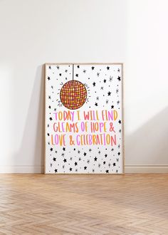 a poster on the wall with words about love and celebration written in pink, orange, and yellow