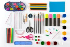 an assortment of arts and crafts supplies displayed on a white background with space for text