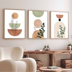 three art prints hanging on the wall in a living room