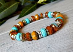 About the Bracelet A beautiful mix of orange and turquoise on this womens boho chic bracelet. This is a great go-to everyday bracelet. Bracelet Details: This boho bracelet is made with: ♥ 8x5mm Turquoise Howlite ♥ 8x6mm Rustic Czech Beads in Orange, Yellow and Turquoise All items are handmade and shipped within 1-3 business days. FREE U.S. SHIPPING ON ORDERS OVER $35 ON ORDERS OVER $35 Thank you for supporting small business. All designs are protected by copyright laws All Rights Reserved. ©Ston Orange Beaded Bracelets, Elastic Bracelets, Boho Chic Bracelets, Rustic Orange, Everyday Bracelet, Artisan Bracelets, Chic Bracelet, Turquoise Boho, Beads Bracelet Design