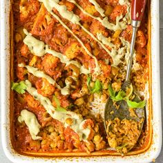 a casserole dish filled with meat and sauce