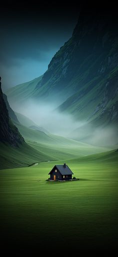 an image of a house in the middle of a green field with mountains behind it