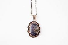 "This gorgeous pendant is made with a stunning polished Amethyst stone set in a 100% Bronze casing with the most delicate rose detail. The pendant comes with a matching chain measuring 17.5 inches. Pendant width: 1.25\" Pendant height: 2\"  All orders are shipped within 24 hours of payment. If you have ANY questions please feel free to ask =) Thank you for stopping by! Be sure to check out our other other items: cicijewelers.etsy.com" Asymmetrical Necklace, Turkish Gifts, Unusual Rings, Sea Glass Pendant, Wire Pendant, Bronze Pendant, Flower Detail, Inspired Jewelry, Gemstone Necklace Pendant