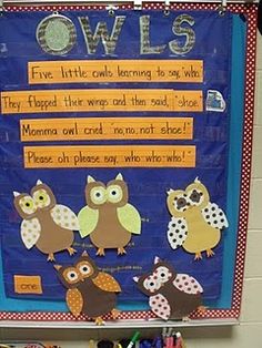 a bulletin board with owls on it